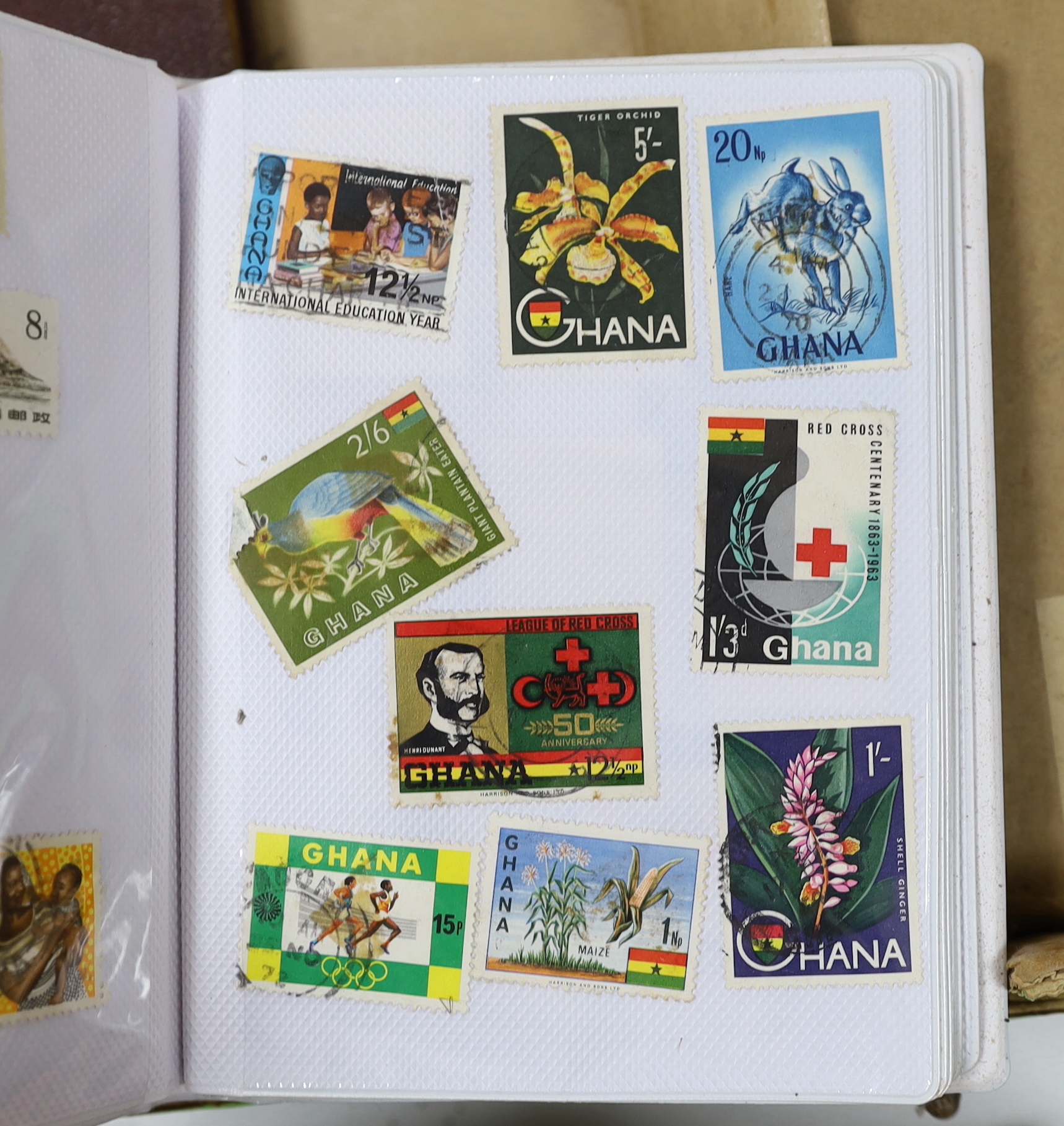 A box of mixed stamp albums